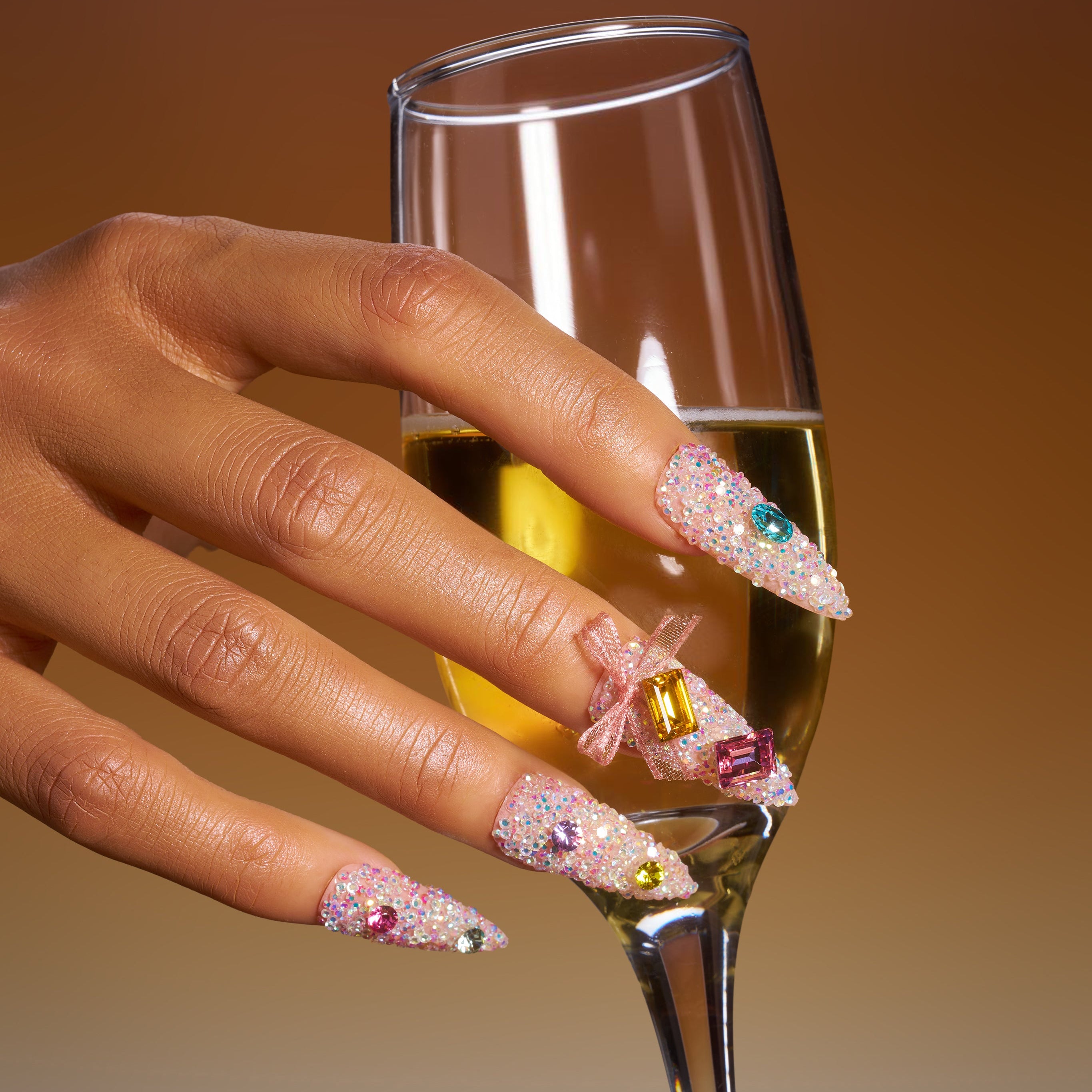 Almond luxury press on nails featuring genuine Swarovski® crystals. Handmade reusable high-shine nail set.