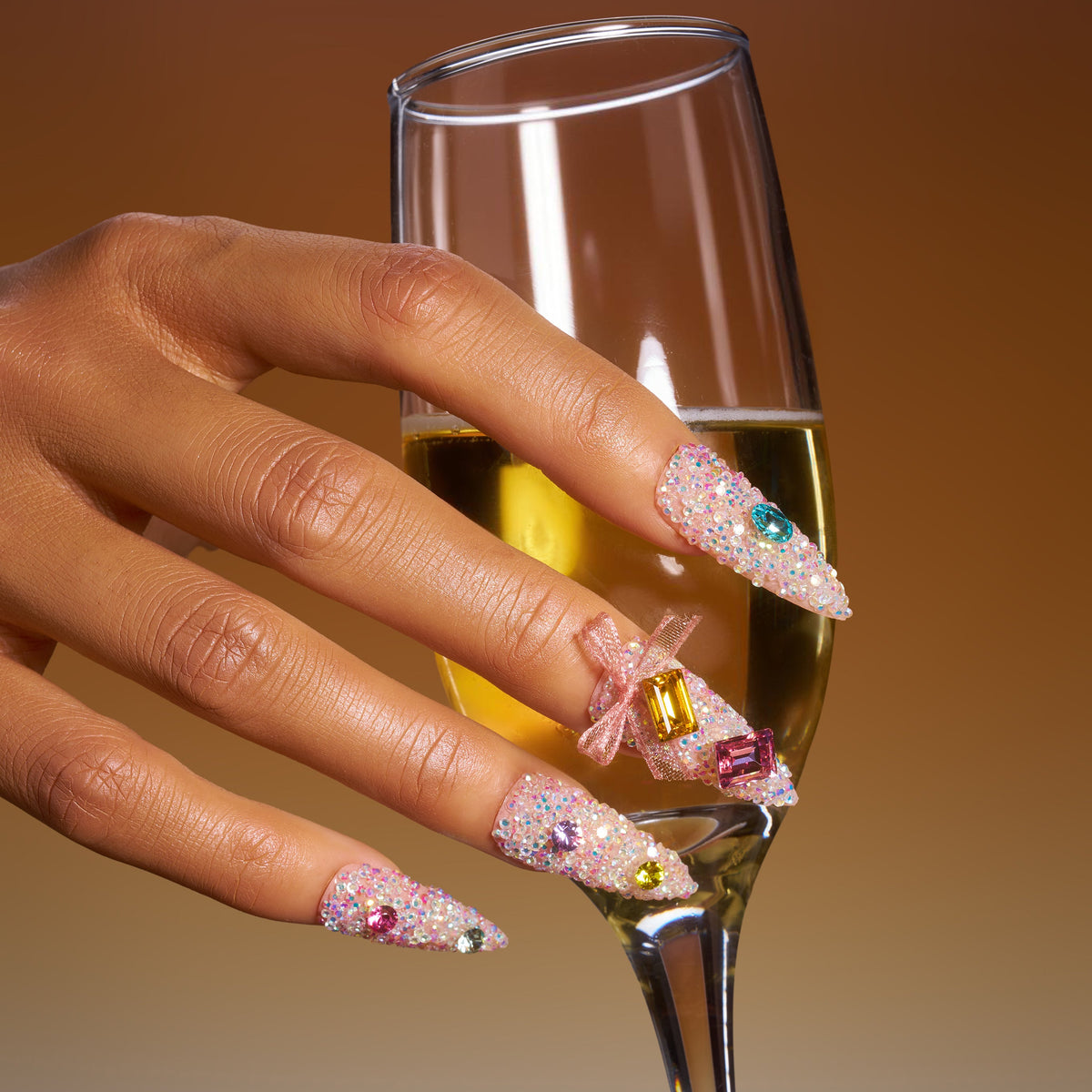 Almond luxury press on nails featuring genuine Swarovski® crystals. Handmade reusable high-shine nail set.