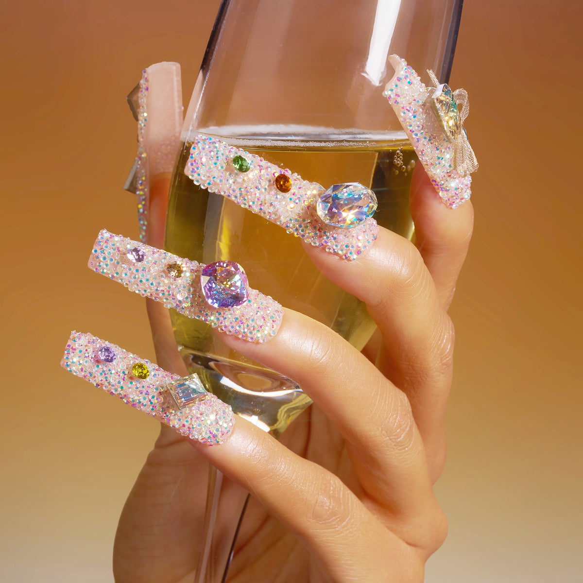 Luxury press on nails featuring genuine Swarovski® crystals. High-shine glam reusable nail art set.