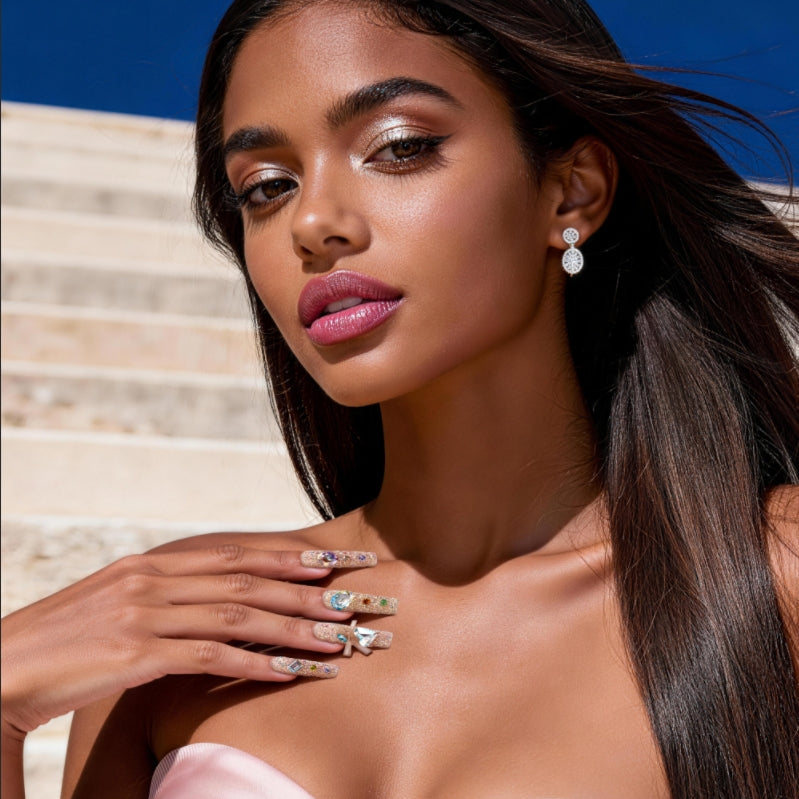 Luxury press on nails featuring genuine Swarovski® crystals. High-shine glam reusable nail art set.