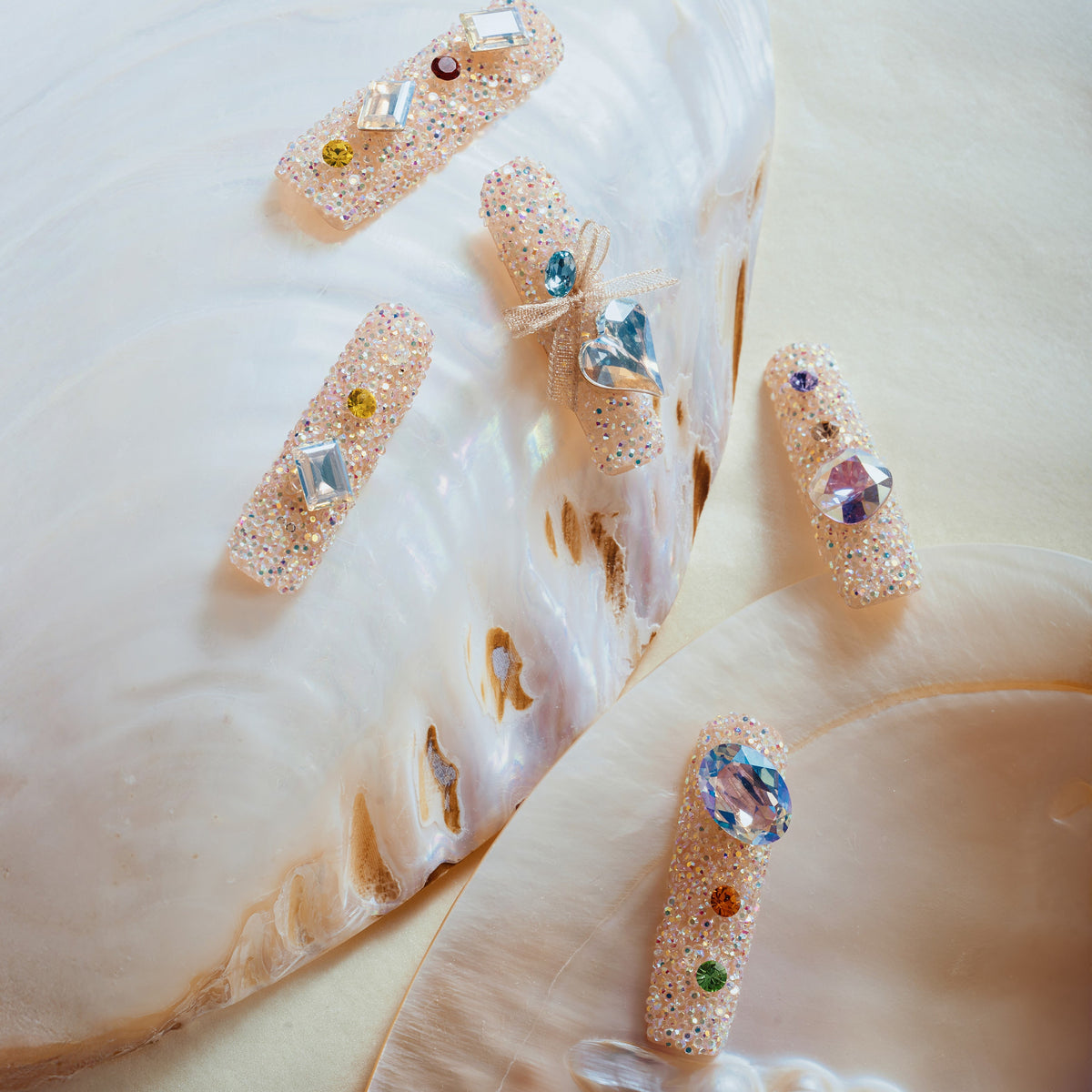 Luxury press on nails featuring genuine Swarovski® crystals. High-shine glam reusable nail art set.