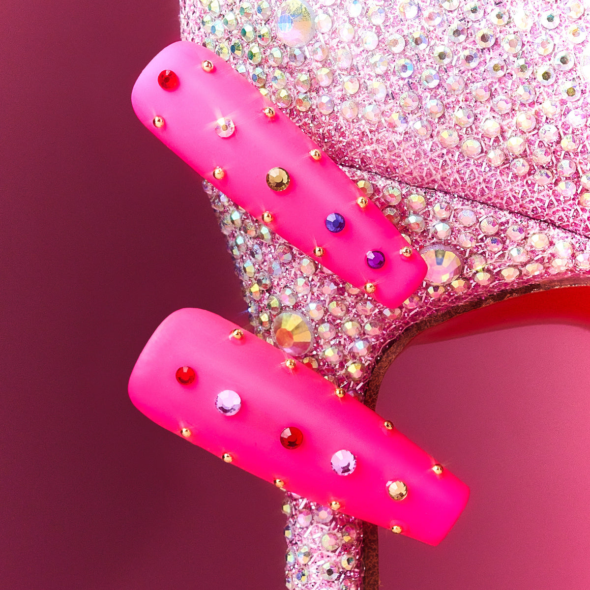 Hot pink luxury press on nails with multicolor crystal embellishments