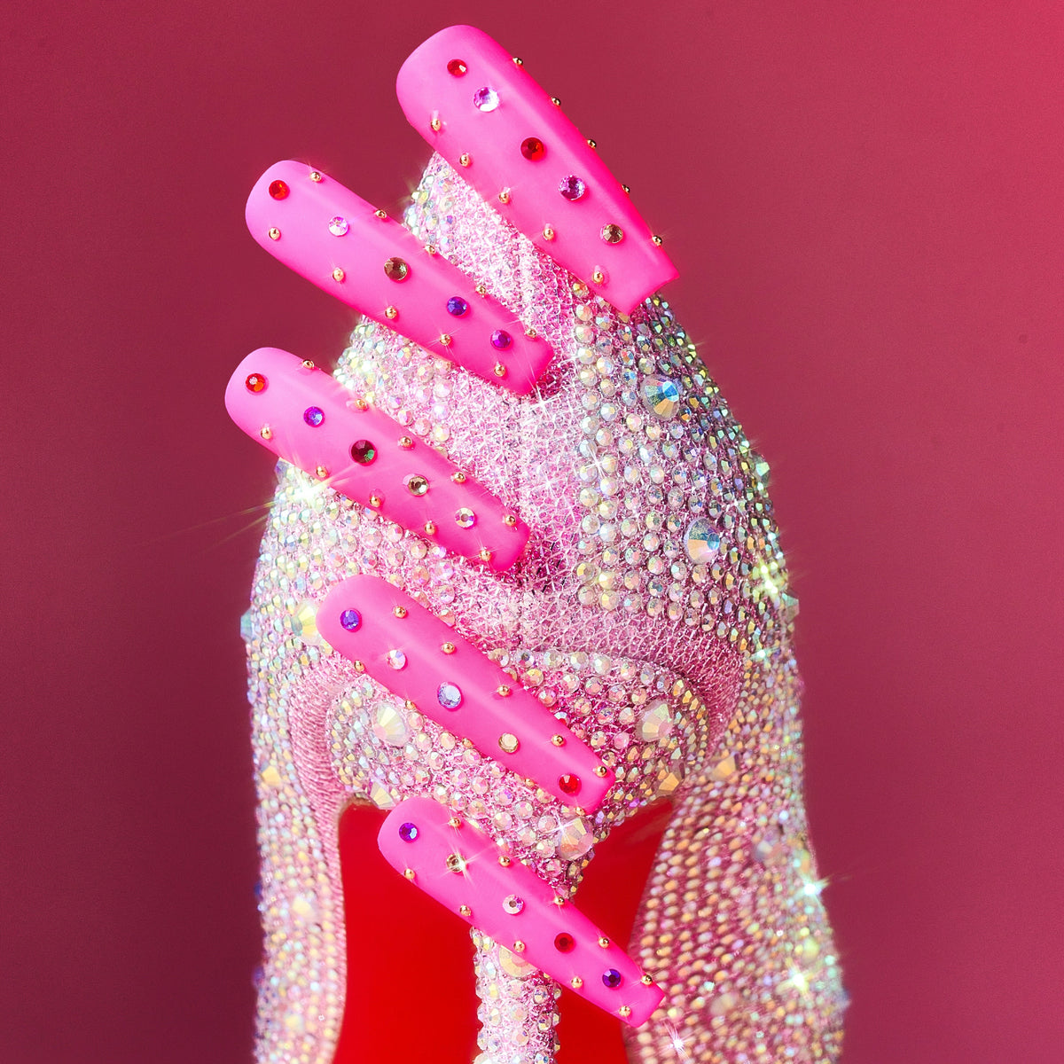Hot pink luxury press on nails with multicolor crystal embellishments