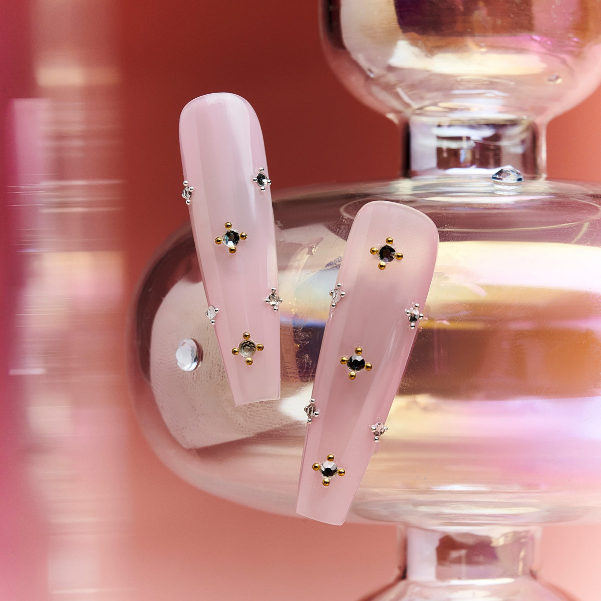 Elegant pink press on nails with crystal gem details. Glossy coffin shape, reusable and perfect for chic everyday glam.