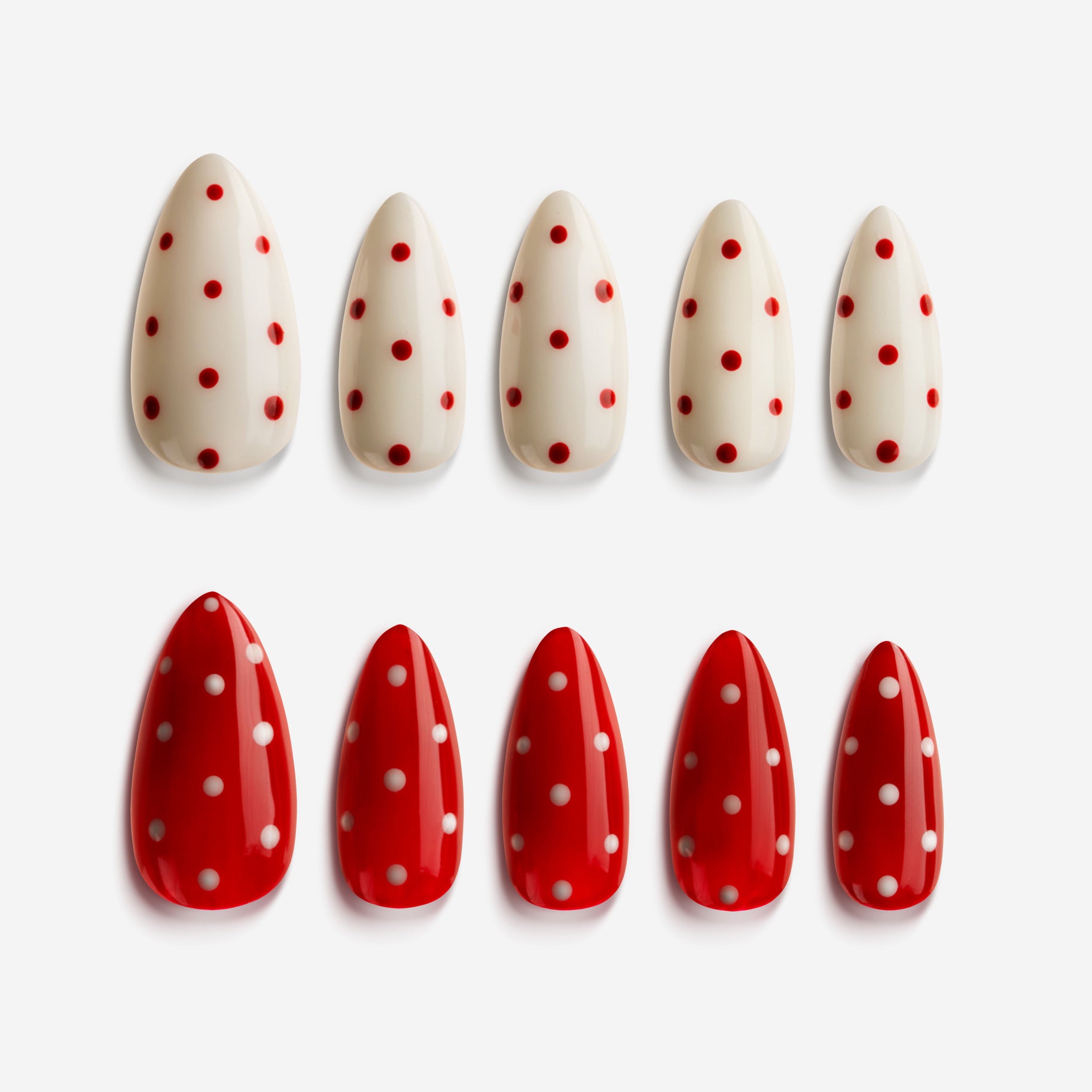 Color-mix polka dot press on nails in red, pink, and nude for playful nail art