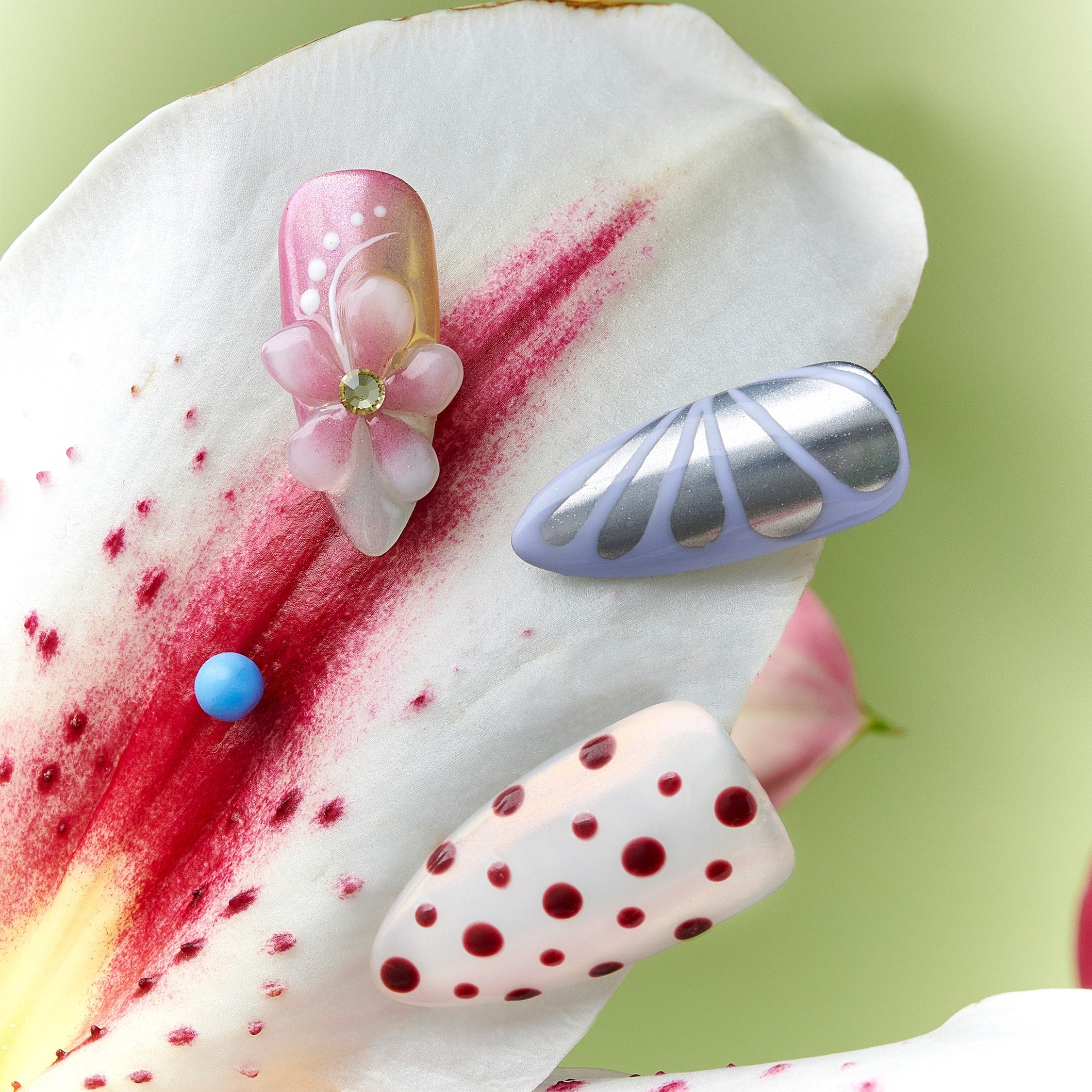 Soft pastel polka dot press on nails with pink and cream tones