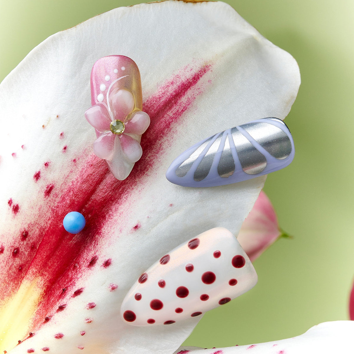 Soft pastel polka dot press on nails with pink and cream tones