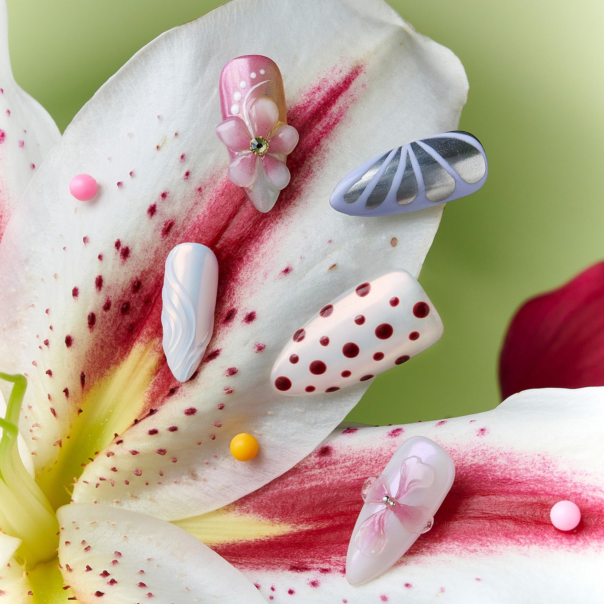 Soft pastel polka dot press on nails with pink and cream tones