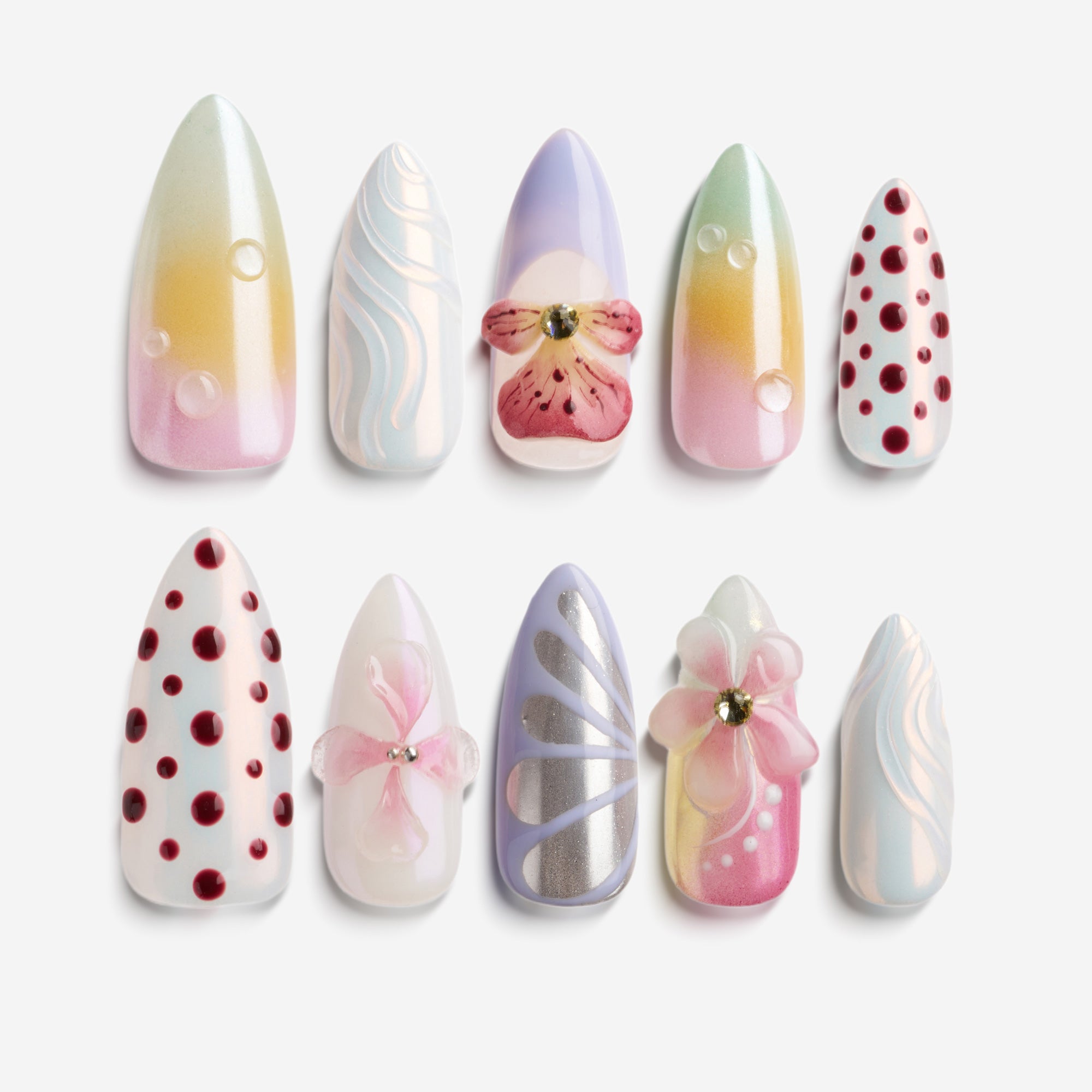 Soft pastel polka dot press on nails with pink and cream tones