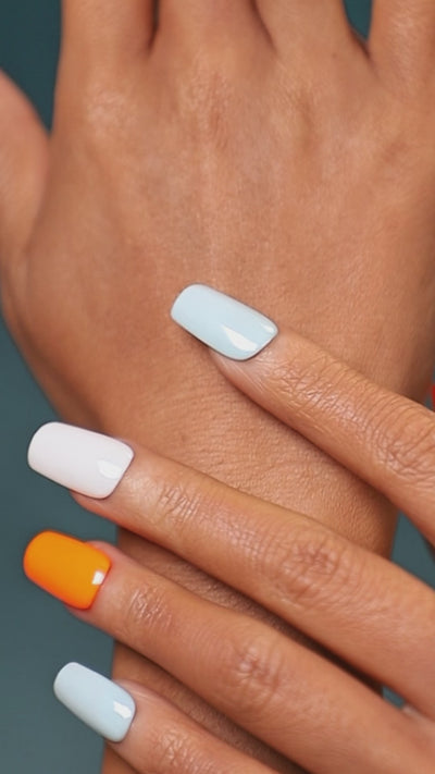 Cool tone abstract press on nails in icy blue and grey. Minimal modern manicure set.
