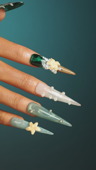 Dresup Ocean Mystique press on nails with green gradient and 3D sea elements. Statement stiletto false nails.