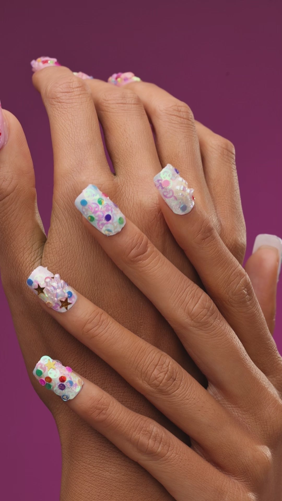 Colorful iridescent 3D press on nails with stars and glitter. Cute festival-ready statement set.