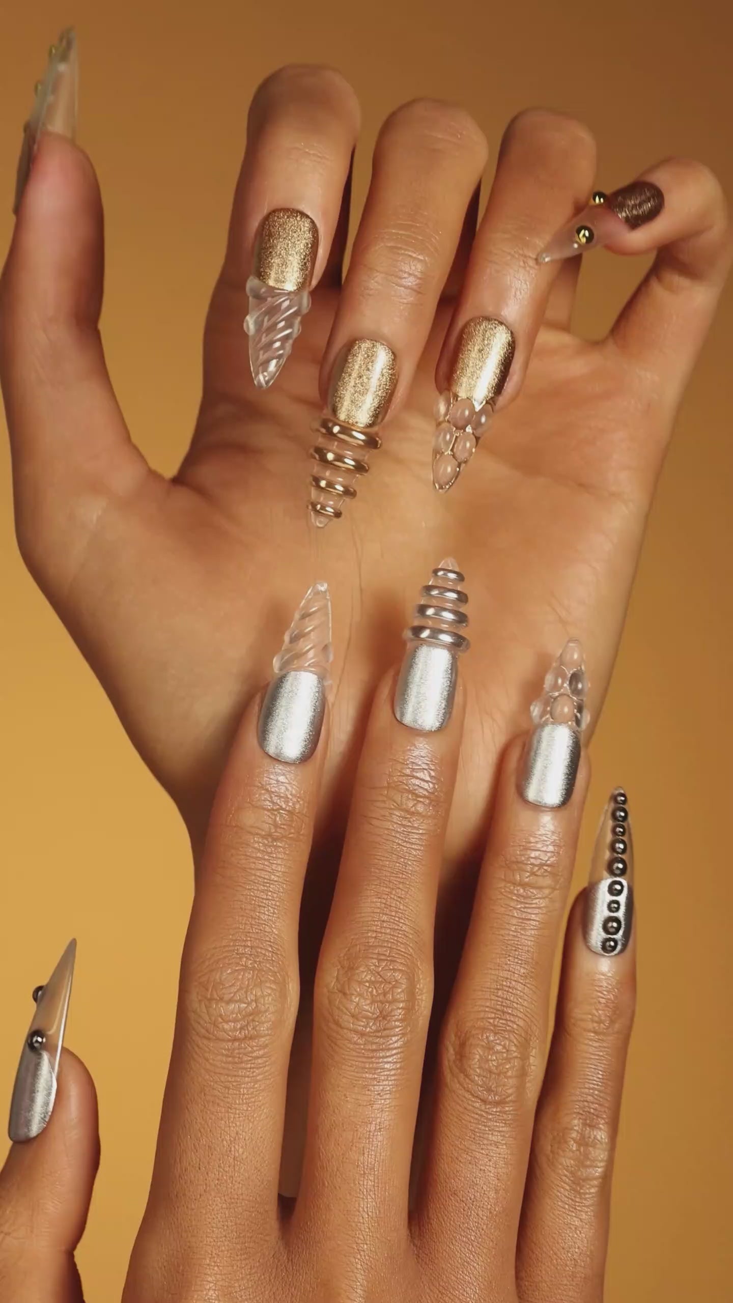 Dresup Metallic Wave press on nails with gold and silver chrome finish. Trendy metallic false nails.