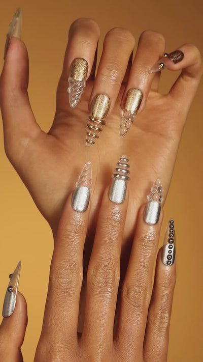 Dresup Metallic Wave press on nails with gold and silver chrome finish. Trendy metallic false nails.