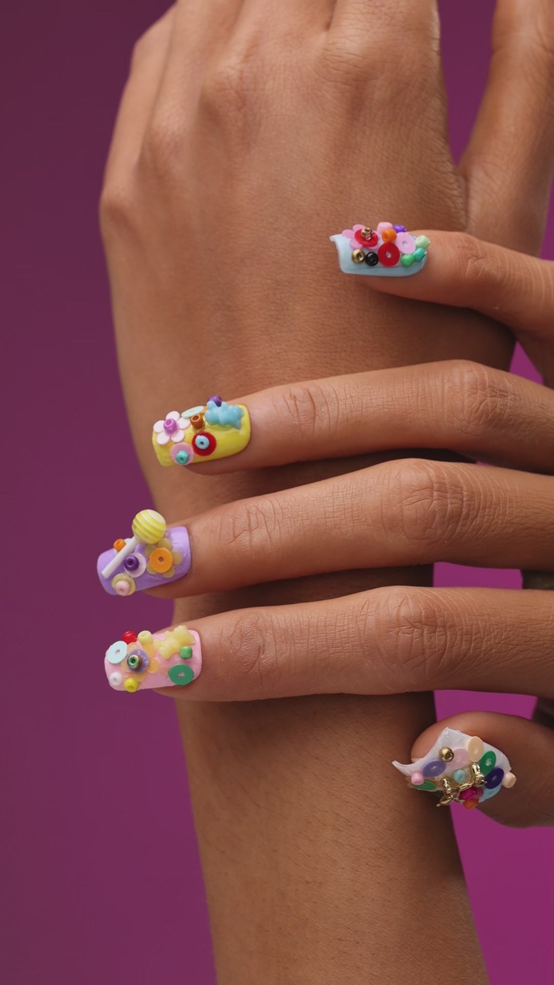 3D candy-inspired press on nails with beads and lollipop accents. Playful handmade nail set.