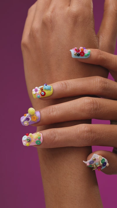 3D candy-inspired press on nails with beads and lollipop accents. Playful handmade nail set.