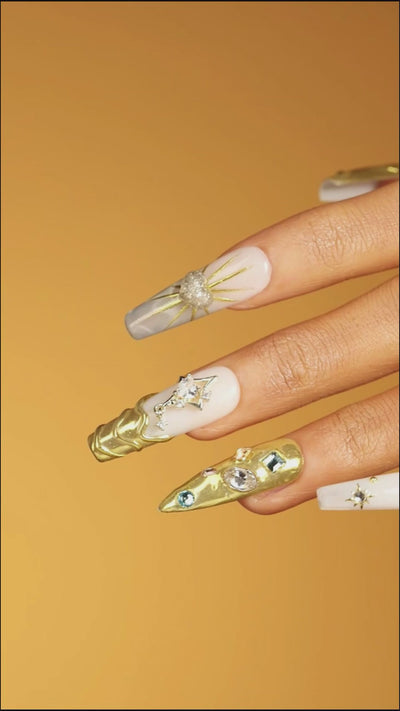 Luxury gold chrome press on nails with crystal details. High shine, sculpted texture and reusable glam design.