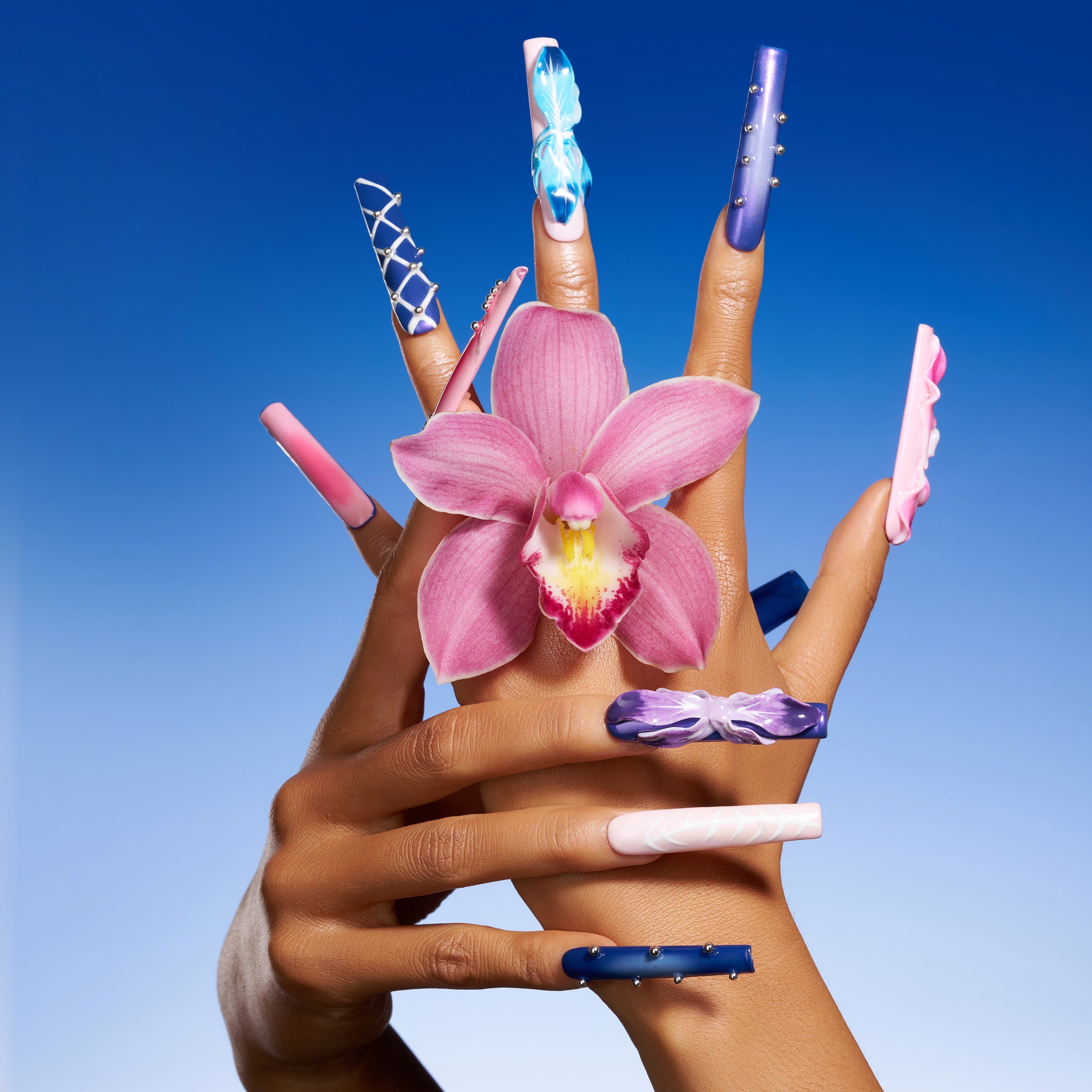 Handmade 3D butterfly coffin press on nails in purple gradient tones. Reusable artistic statement nail set.