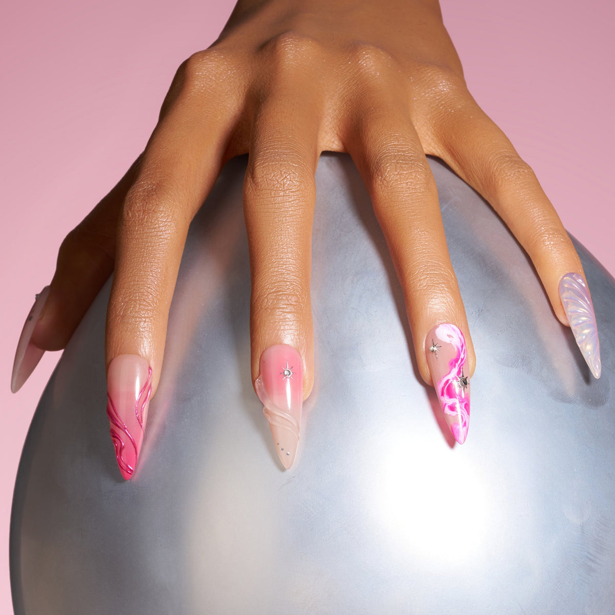 Radiant Sheen long almond press on nails with pink gradients and iridescent wing detail