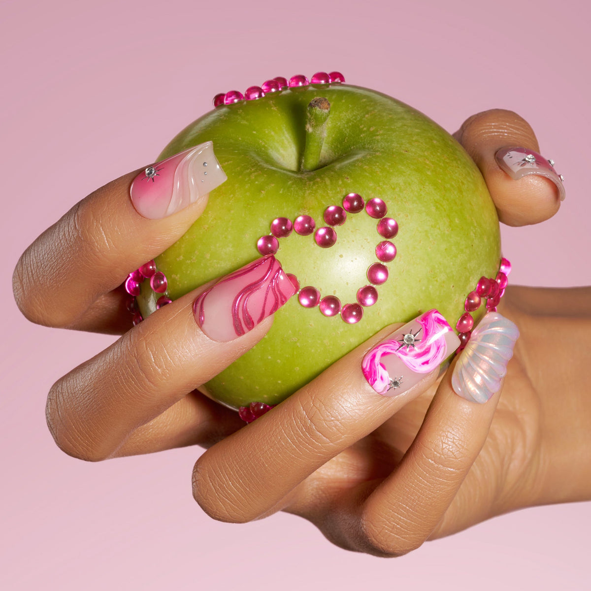 Radiant Sheen press on nails in square shape with pink glow and silver accents