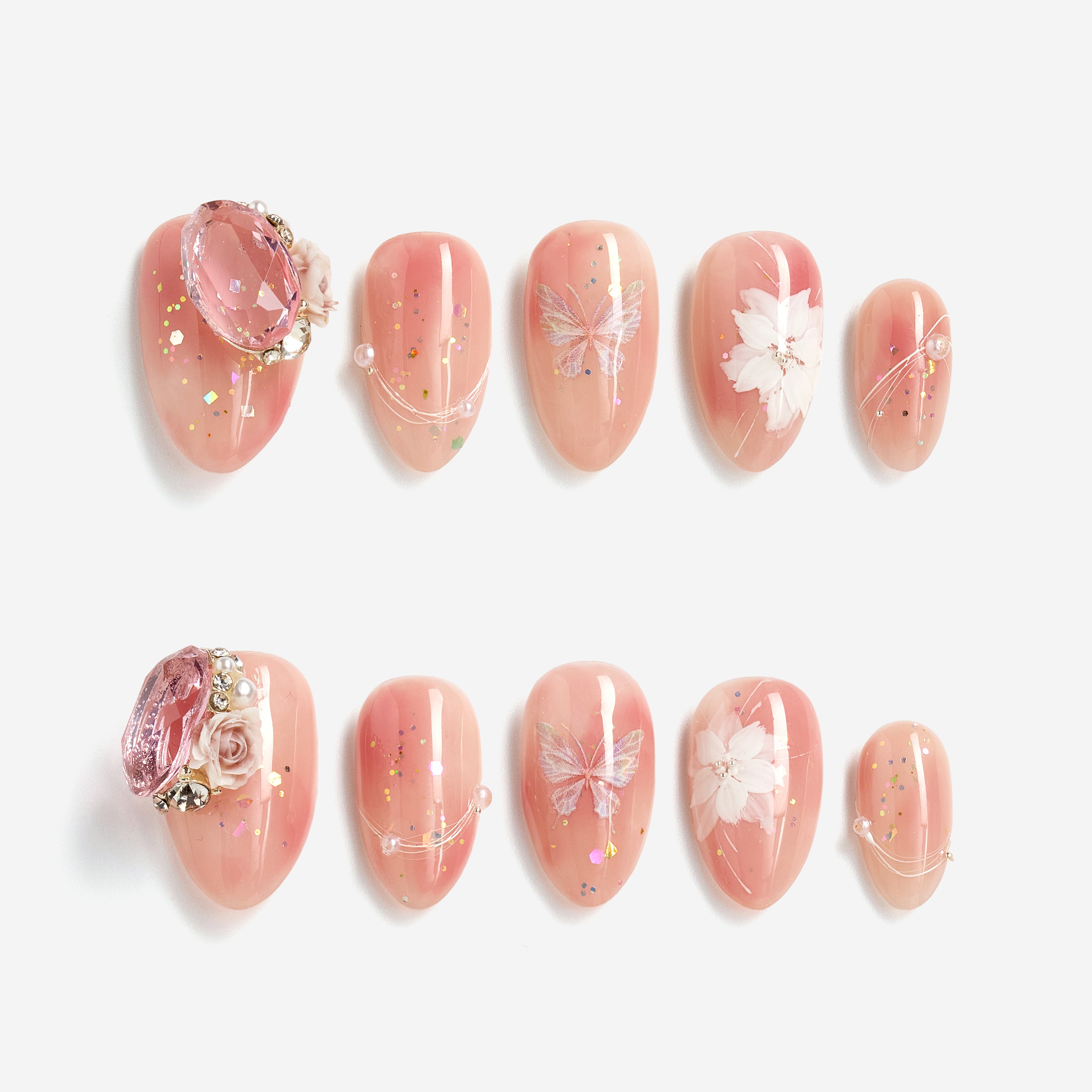 Peach butterfly press on nails with crystal accents and glossy shimmer finish.