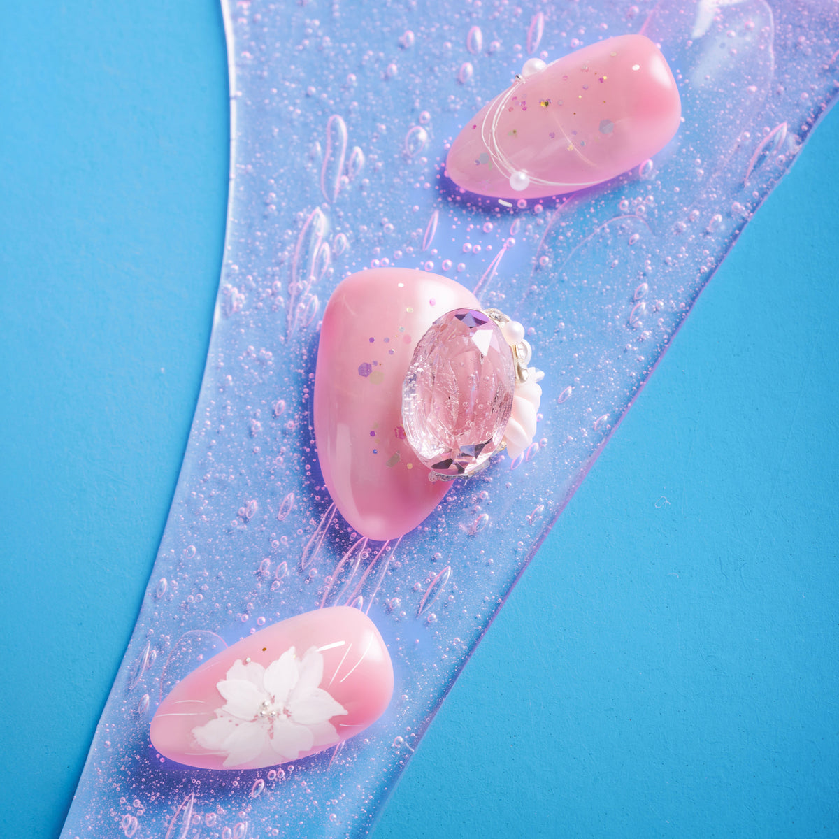 Peach butterfly press on nails with crystal accents and glossy shimmer finish.