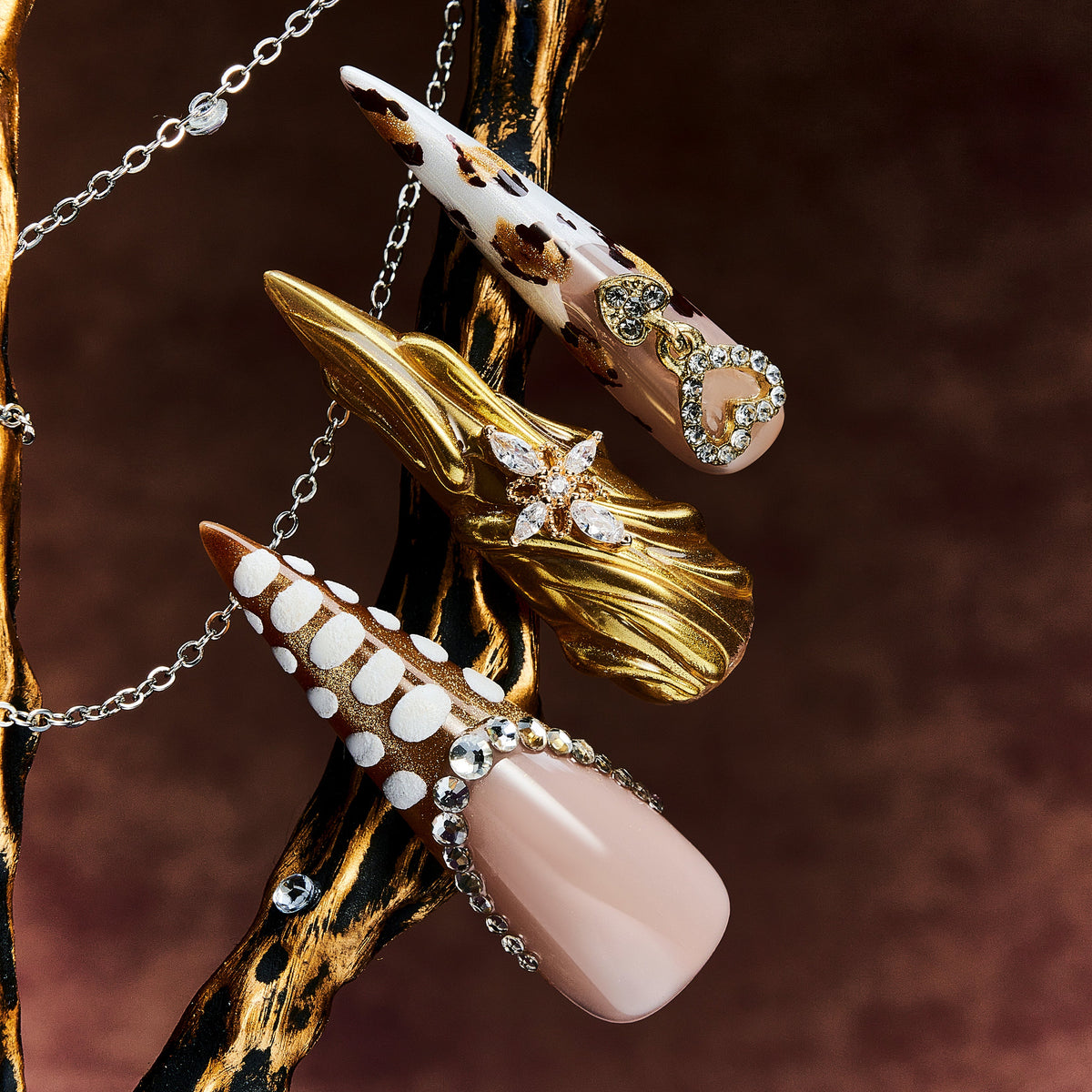 Jewel-inspired luxury press on nails with intricate gemstone arrangements. Handmade reusable nail art set.