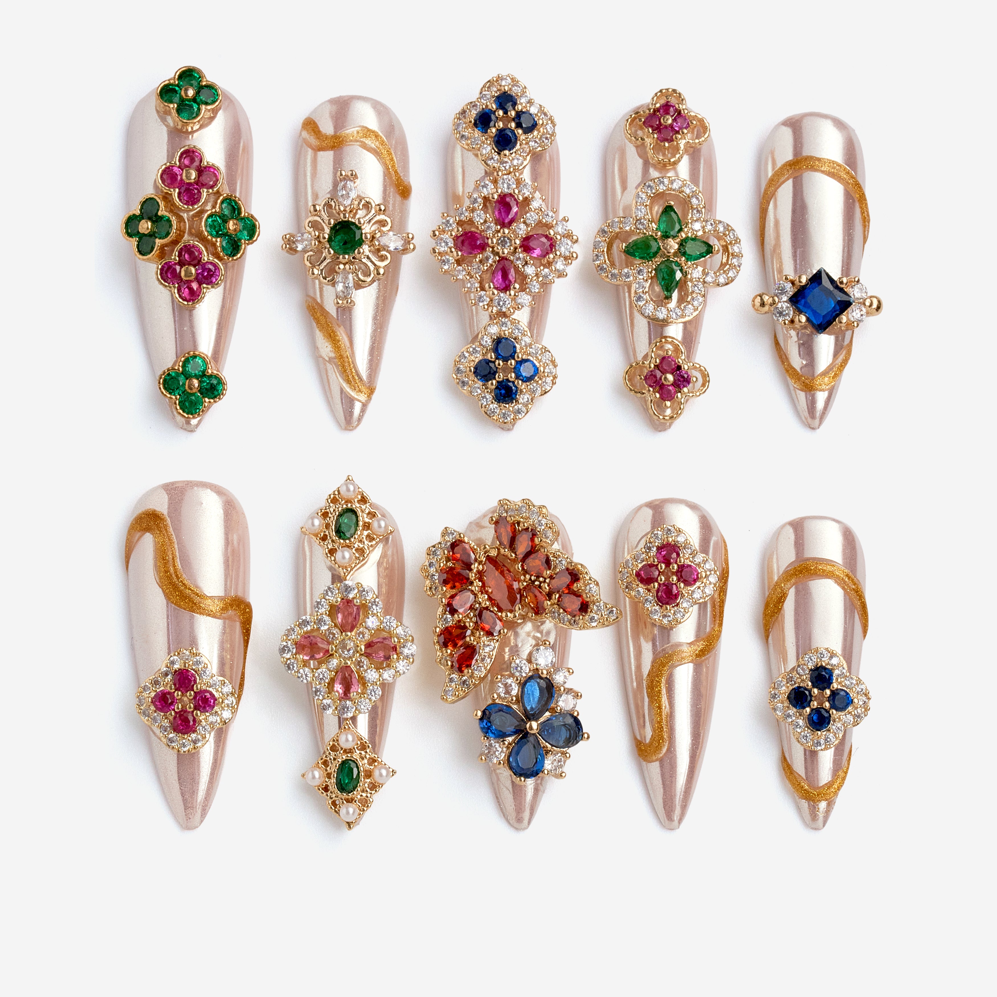 Luxury press on nails with gemstone embellishments and metallic base. Reusable high-end statement nail set.