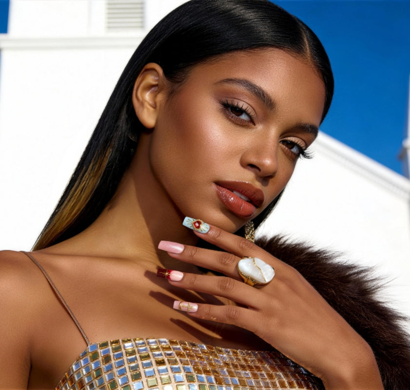 Baroque-inspired luxury press on nails with ornate gold accents and sacred heart details.