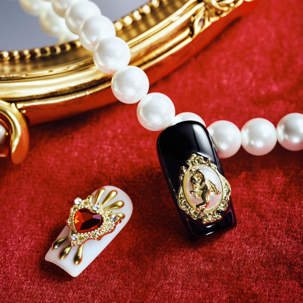 Baroque-inspired luxury press on nails with ornate gold accents and sacred heart details.
