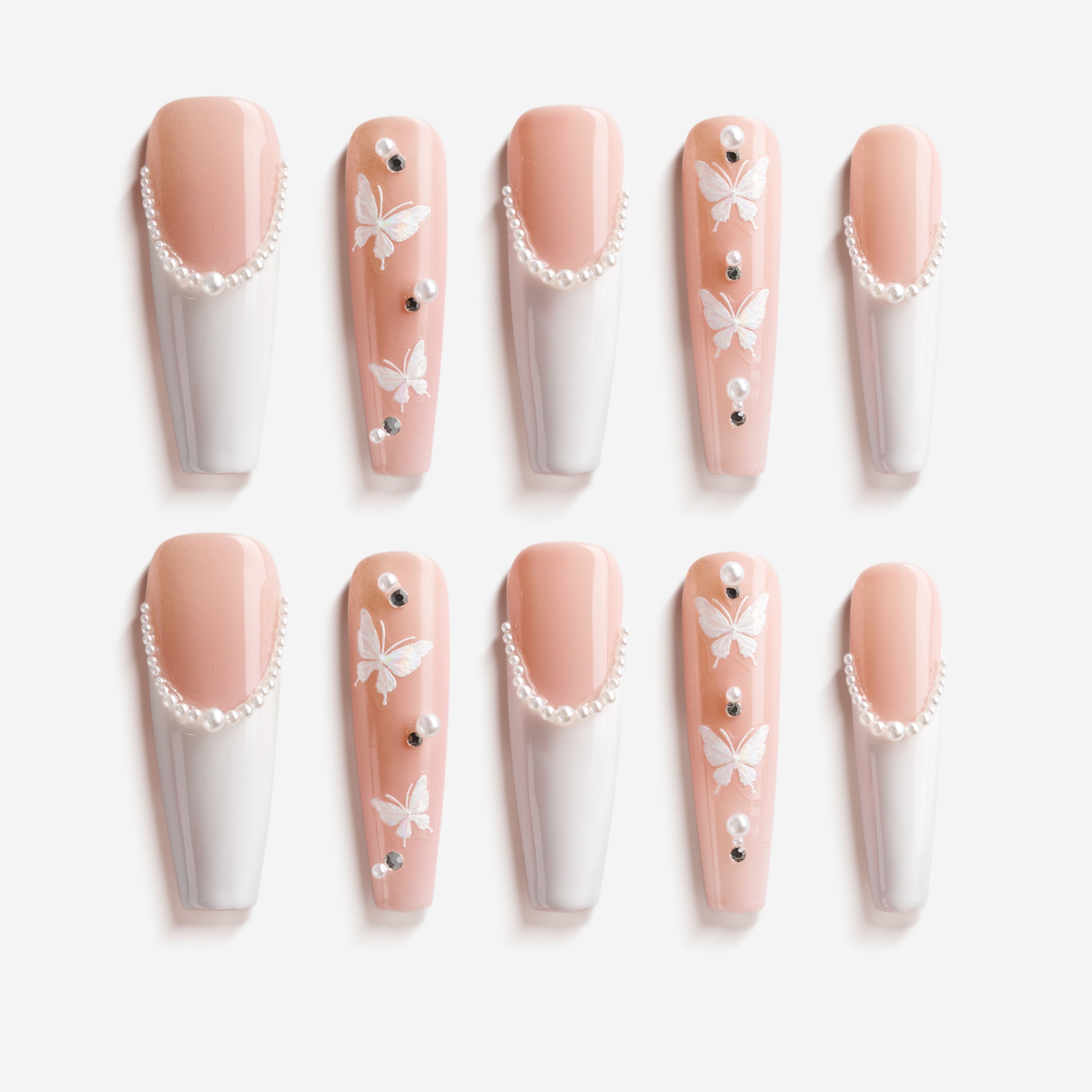 Blush pink ombre press on nails with crystal curves and floral detail. Soft romantic and reusable.