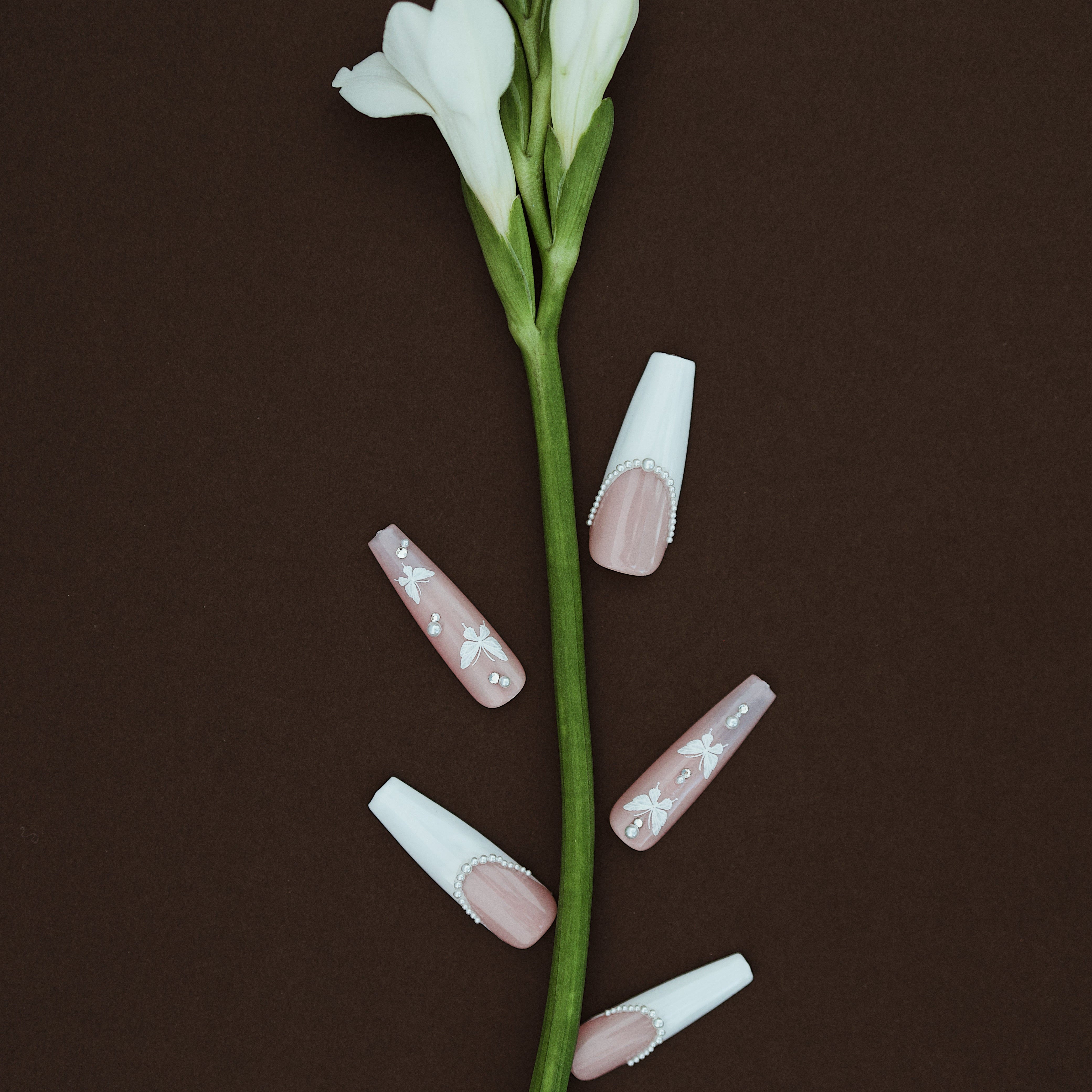 Blush pink ombre press on nails with crystal curves and floral detail. Soft romantic and reusable.