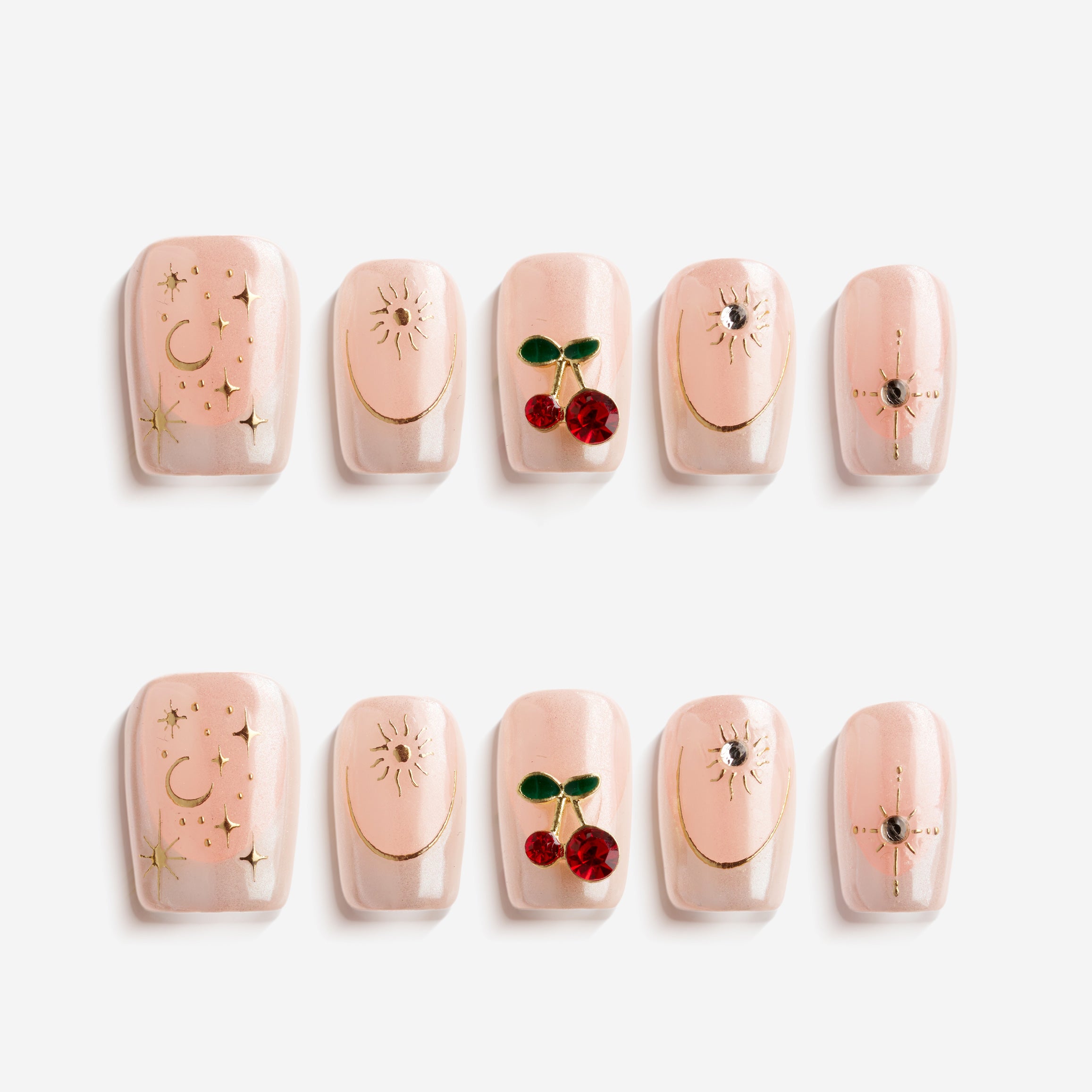 Starlit Cherry pink press on nails with gold accents and cherry details.