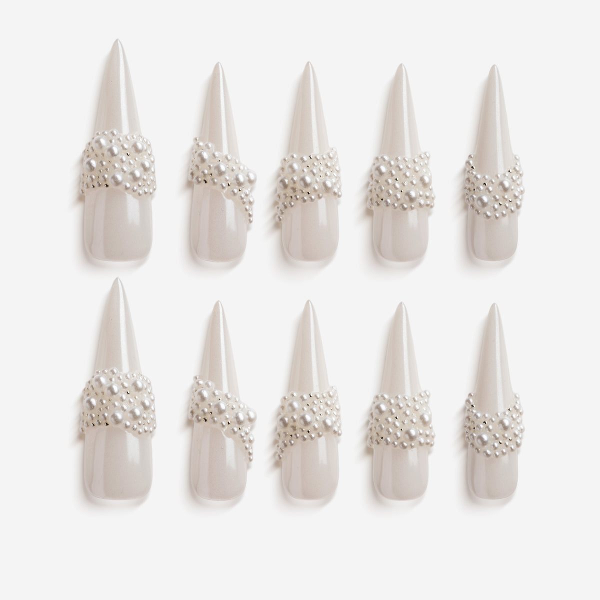 Starry Tips white stiletto press on nails decorated with pearl cluster accents.