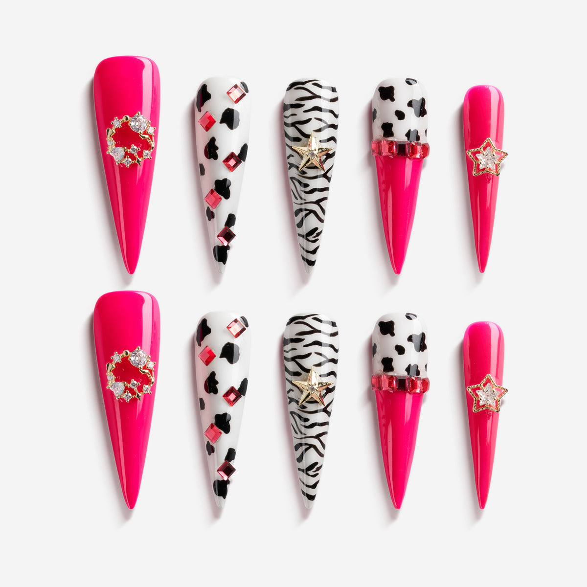 Bold pink press on nails with zebra and leopard accents plus crystal stars. Fun, edgy and reusable.