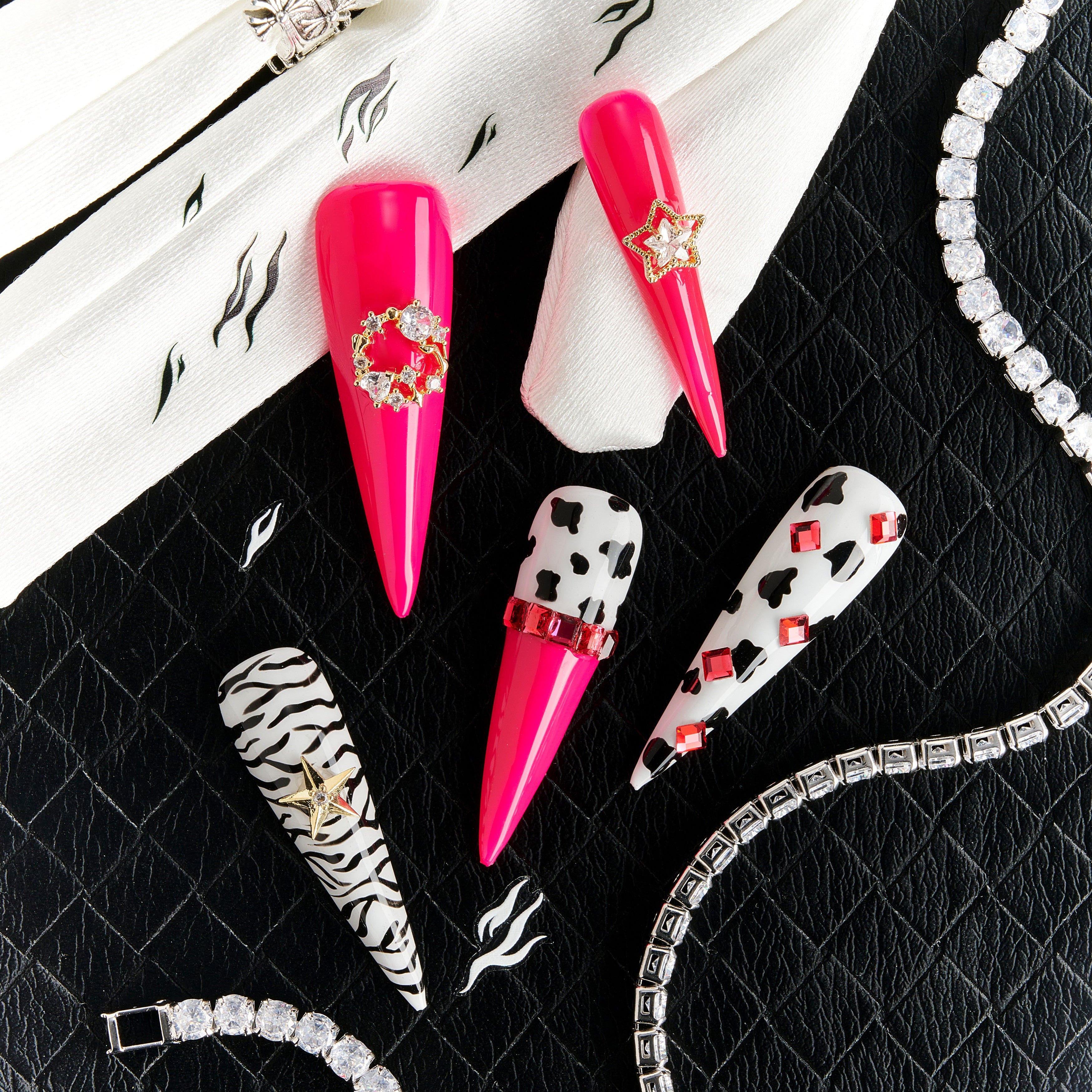 Bold pink press on nails with zebra and leopard accents plus crystal stars. Fun, edgy and reusable.